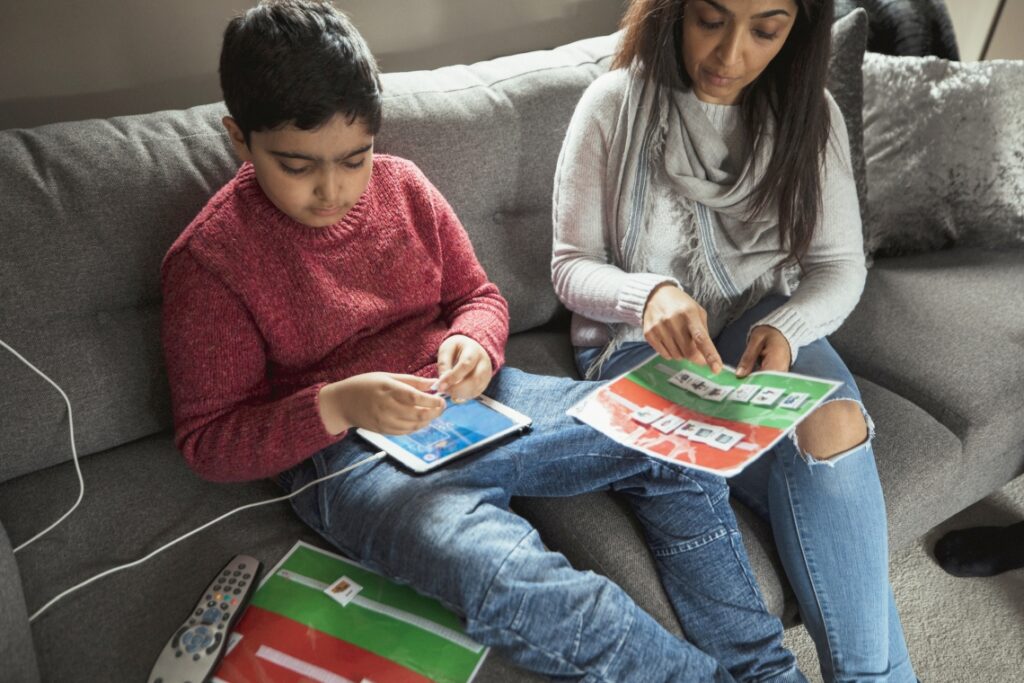 mother and son with AAC communication Book 